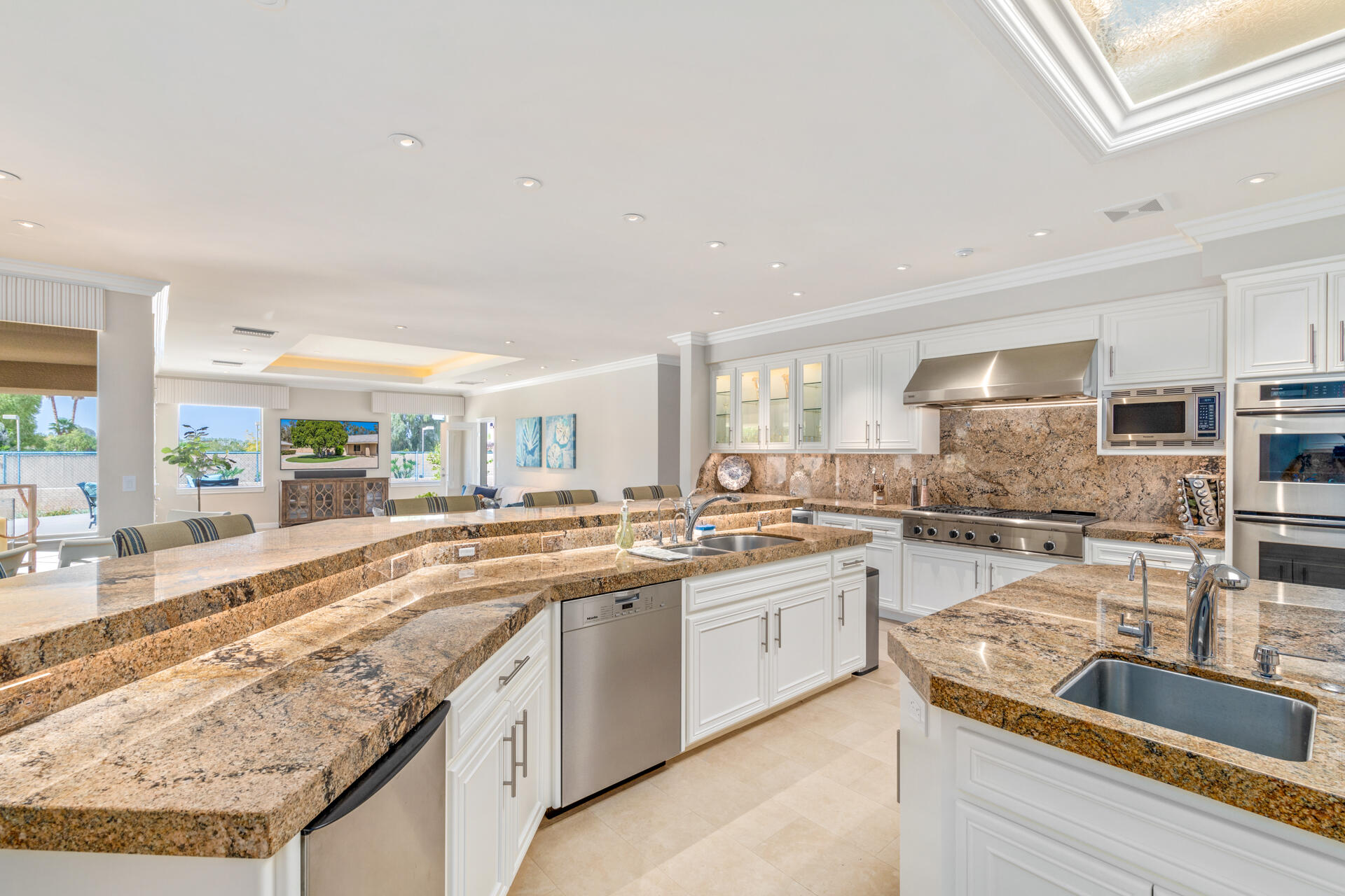 34777 Via Josefina Rancho Mirage, CA 92270 - Photo 15 of 47 an open kitchen with granite countertop a sink and white cabinets