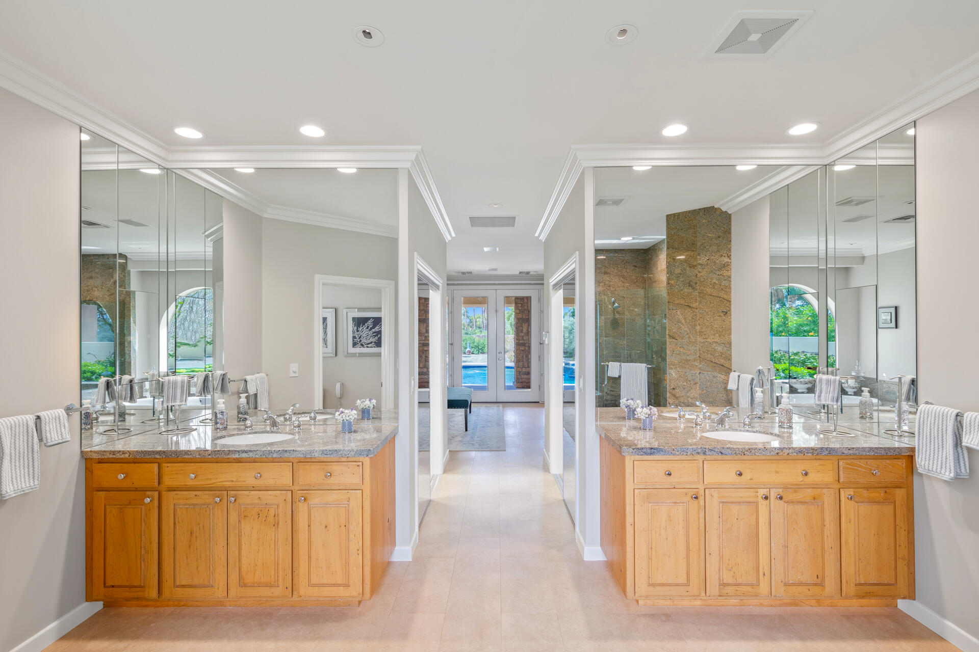 34777 Via Josefina Rancho Mirage, CA 92270 - Photo 23 of 47 a large bathroom with double vanity sinks a large mirror and a bathtub