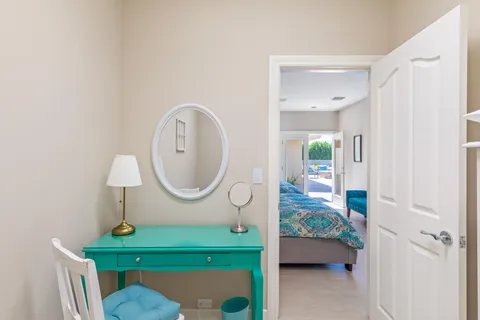 a spacious bedroom with a bed and glass door