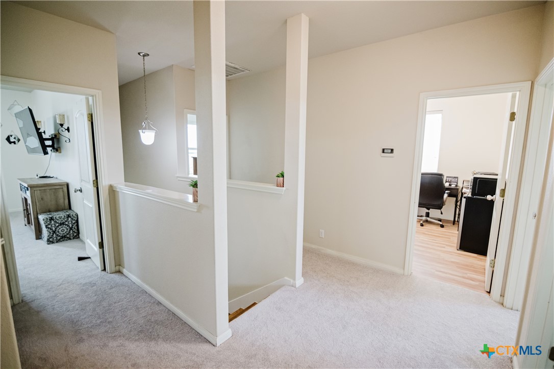 201 Boulder Ridge Drive Cuero, TX 77954 - Photo 16 of 37 a view of a hallway with shelves