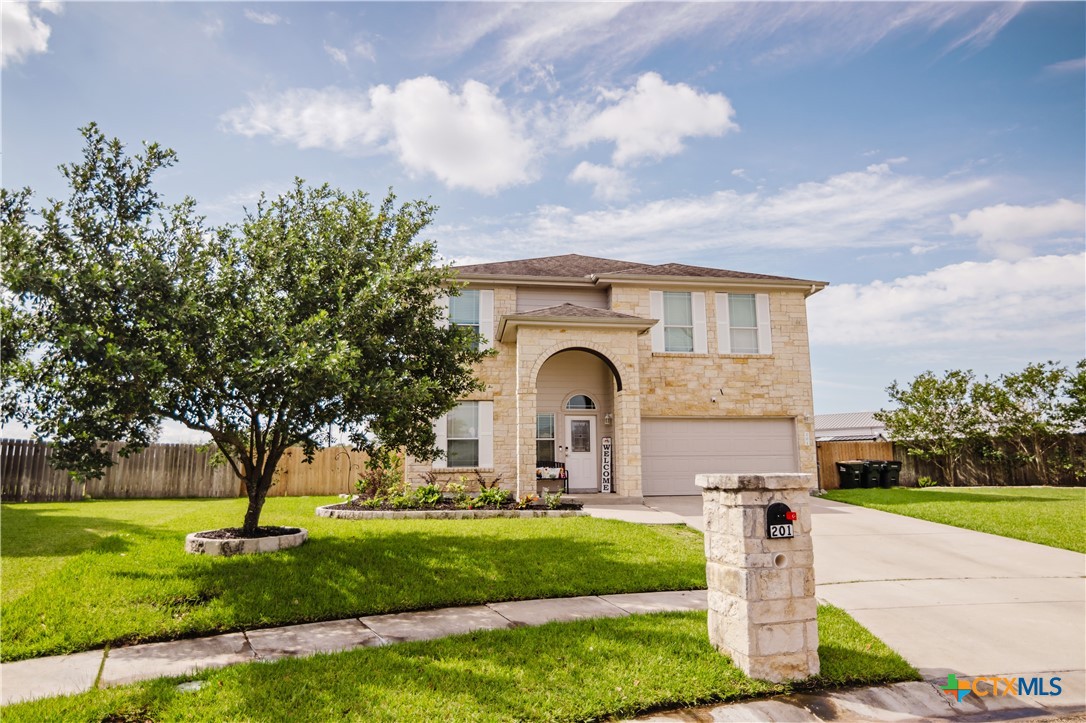 201 Boulder Ridge Drive Cuero, TX 77954 - Photo 2 of 37 a front view of a house with garden