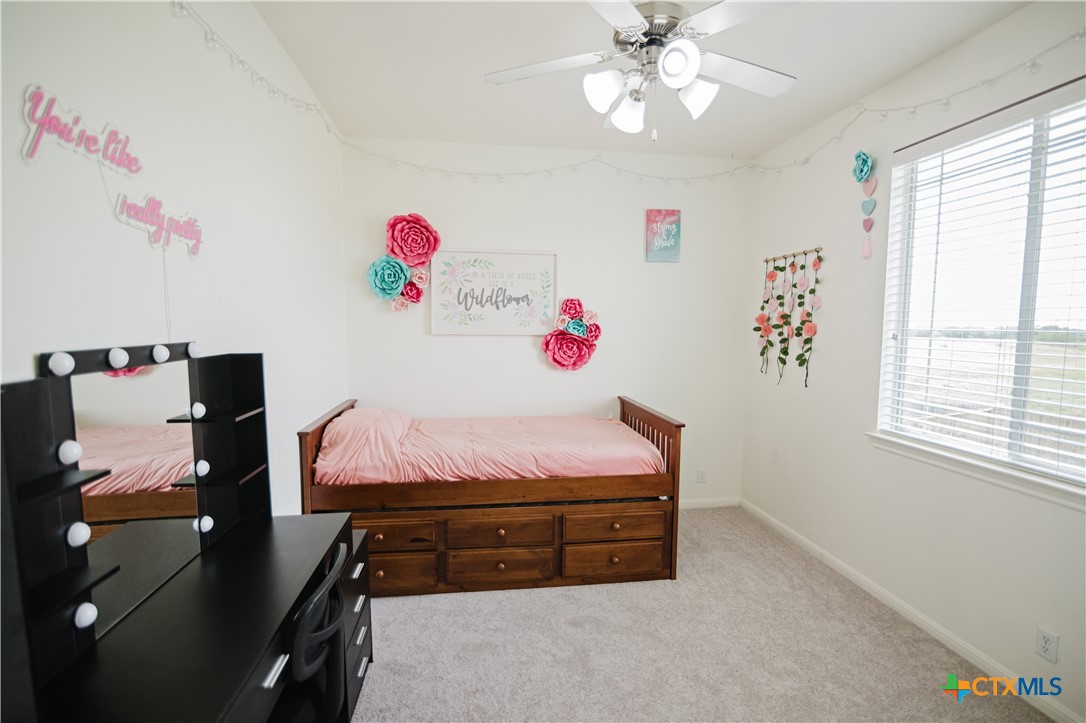 201 Boulder Ridge Drive Cuero, TX 77954 - Photo 29 of 37 a bed room with a bed and a window