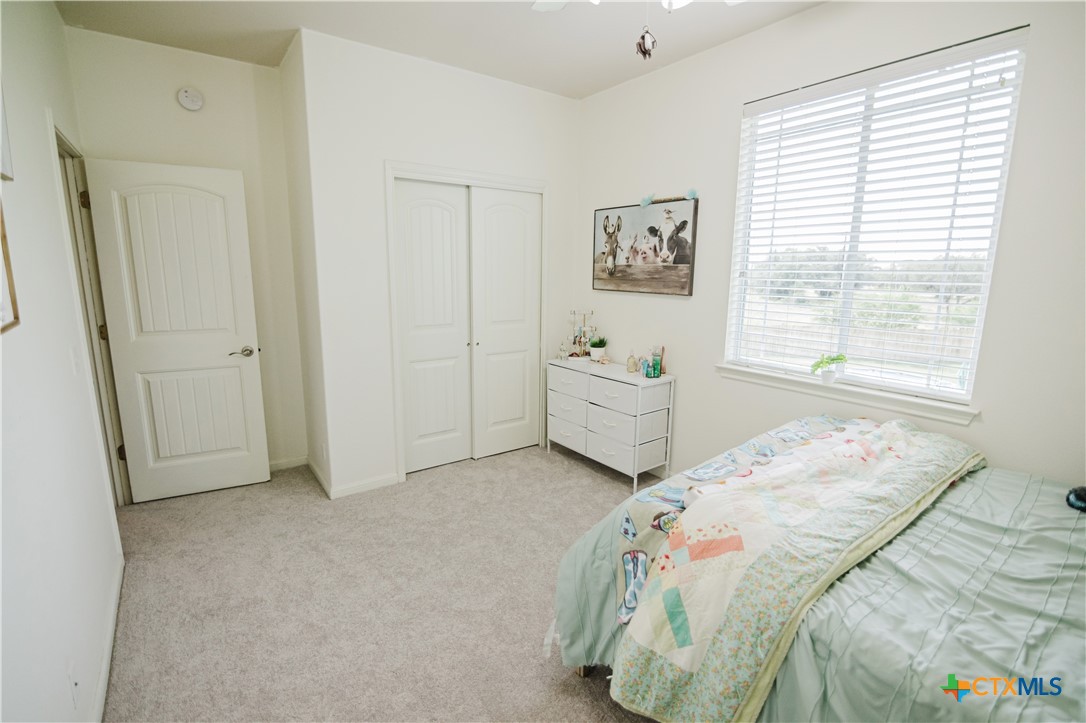 201 Boulder Ridge Drive Cuero, TX 77954 - Photo 34 of 37 a bedroom with bed and window