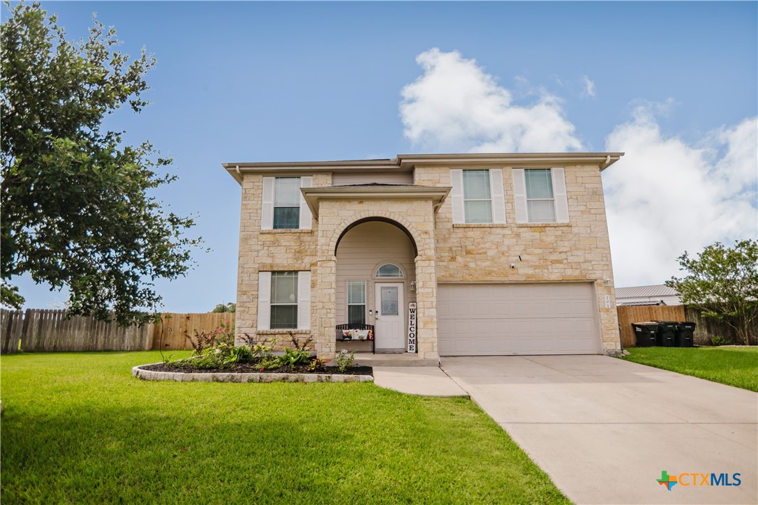 201 Boulder Ridge Drive Cuero, TX 77954 - Photo 4 of 37 a front view of a house with garden