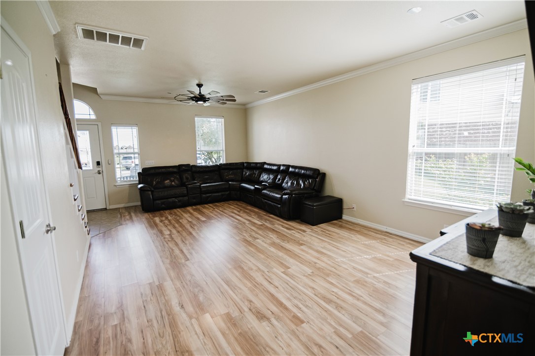 201 Boulder Ridge Drive Cuero, TX 77954 - Photo 7 of 37 a living room with furniture and wooden floor