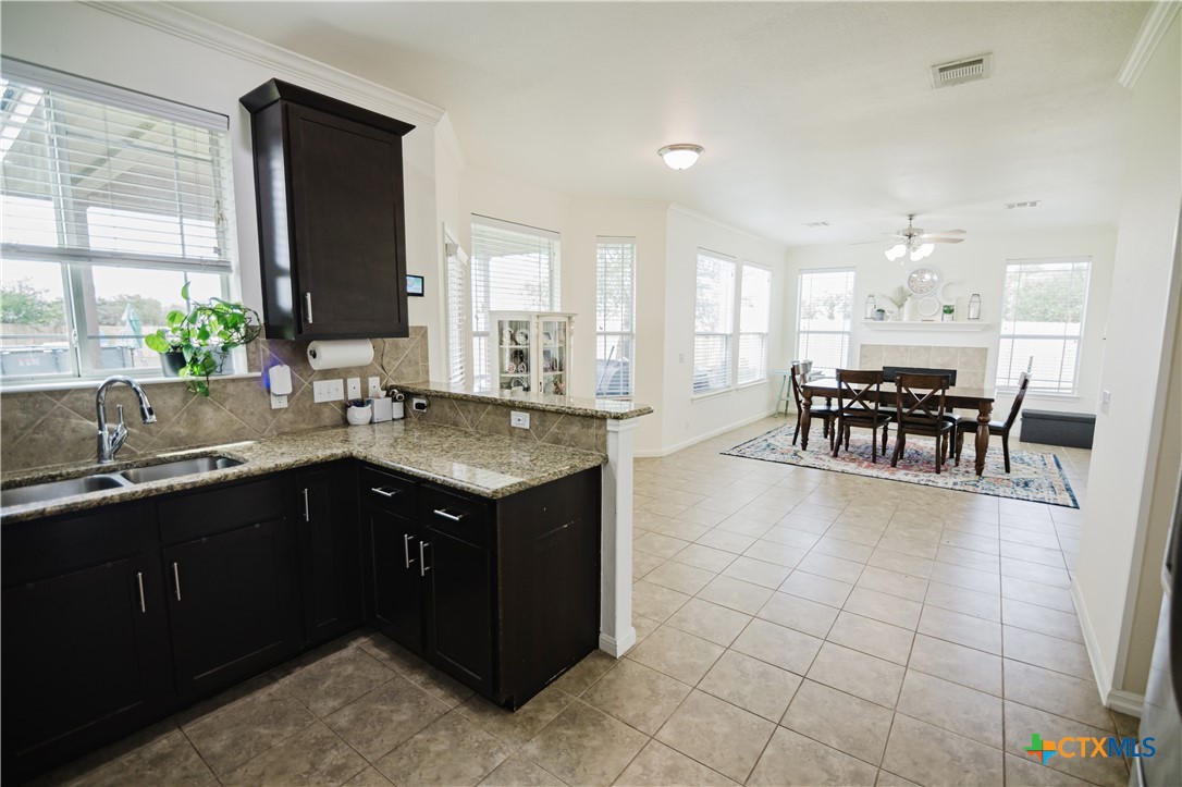201 Boulder Ridge Drive Cuero, TX 77954 - Photo 10 of 37 a kitchen with a sink and counter top space