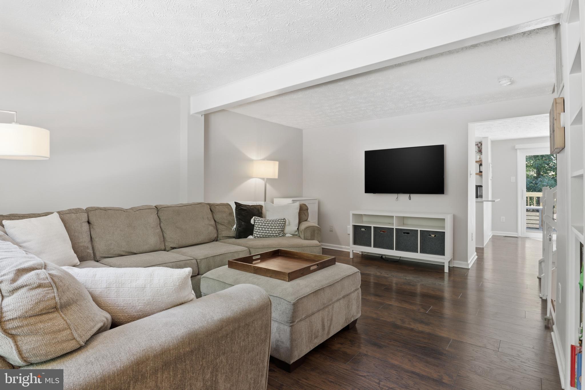 8033 Orange Plank Road Springfield, VA 22153 - Photo 5 of 26 Airy living room with open flow to kitchen
