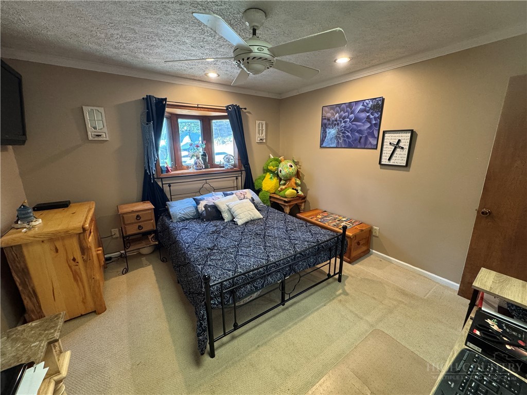 36 Larkspur Road Newland, NC 28657 - Photo 12 of 36 a bedroom with a bed and wooden floor