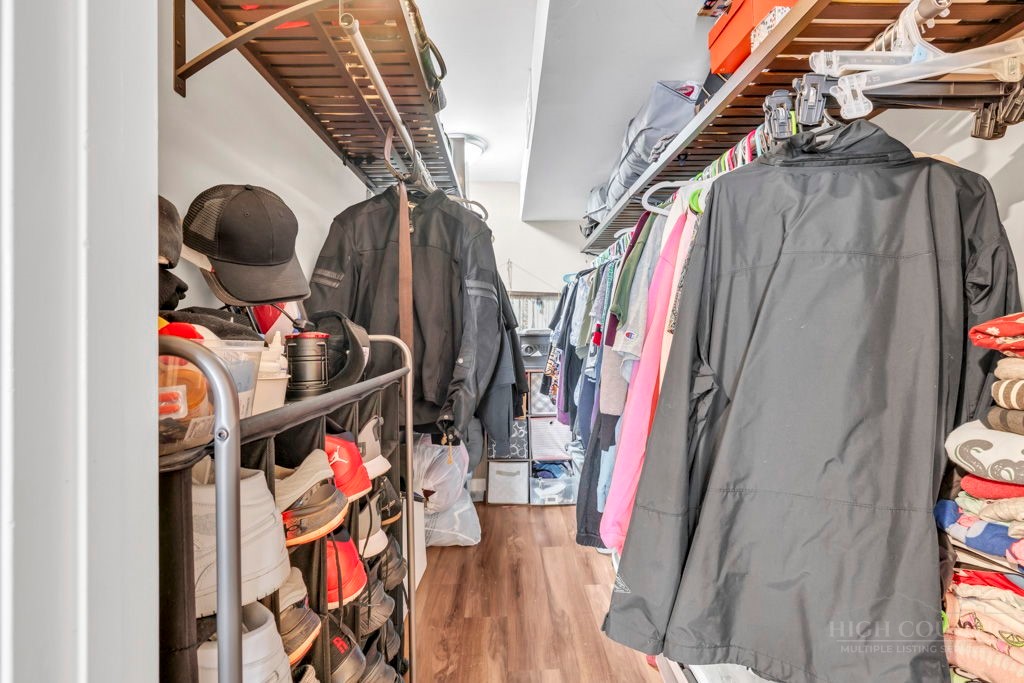 36 Larkspur Road Newland, NC 28657 - Photo 23 of 36 a view of walk in closet with clothes and shoes
