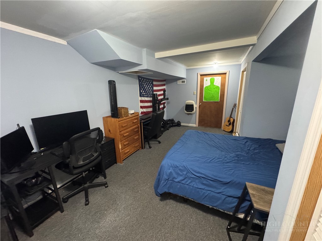 36 Larkspur Road Newland, NC 28657 - Photo 28 of 36 a bedroom with a bed and furniture