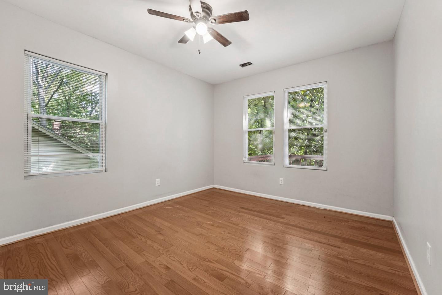 4511 Prospect Circle Baltimore, MD 21216 - Photo 18 of 25 wooden floor in an empty room with a window