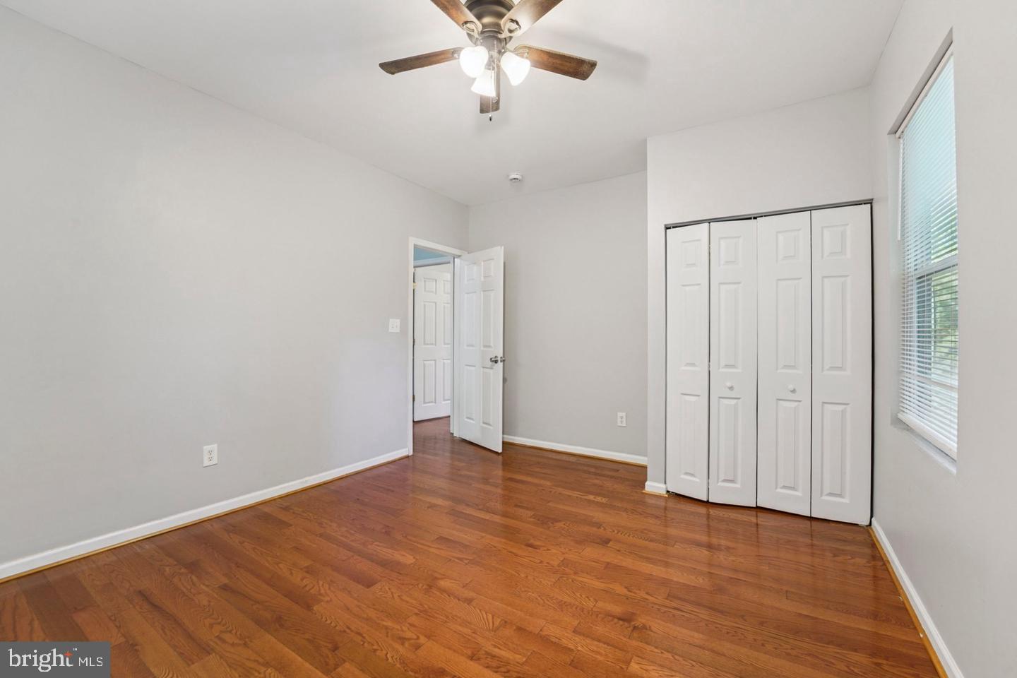4511 Prospect Circle Baltimore, MD 21216 - Photo 19 of 25 a view of an empty room with wooden floor