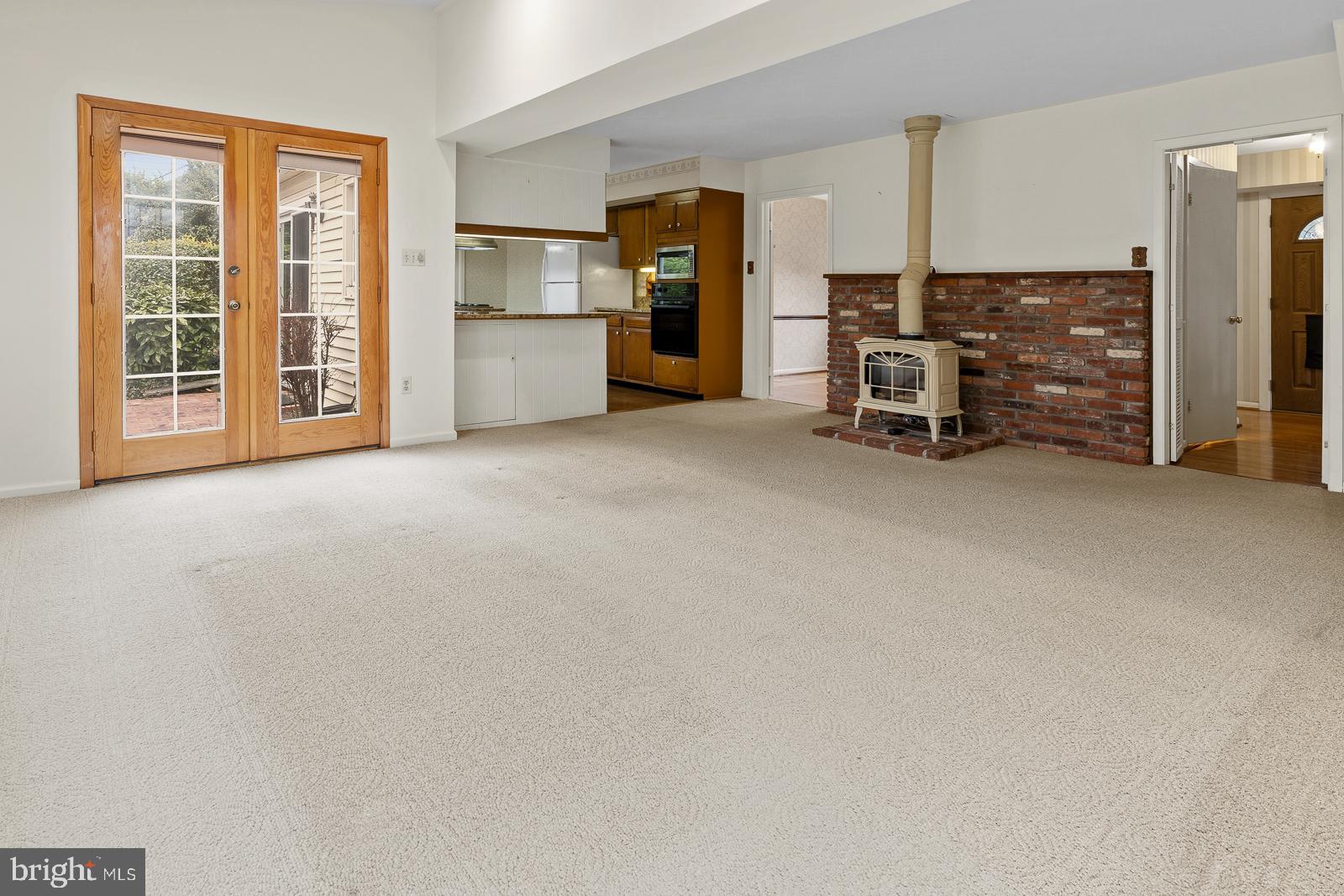 8714 Granite Lane Laurel, MD 20708 - Photo 13 of 35 an empty room with furniture and a kitchen