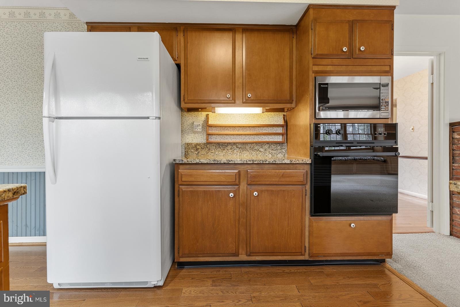 8714 Granite Lane Laurel, MD 20708 - Photo 16 of 35 a kitchen with a refrigerator and cabinets