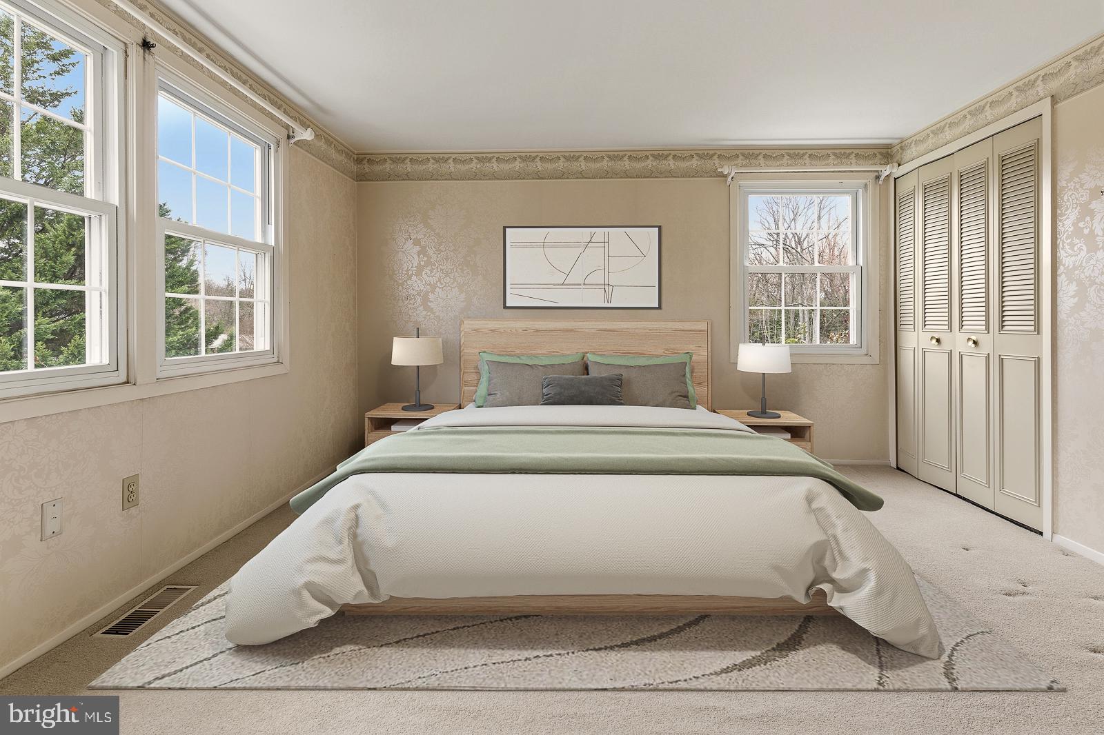 8714 Granite Lane Laurel, MD 20708 - Photo 28 of 35 a bedroom with a bed and windows