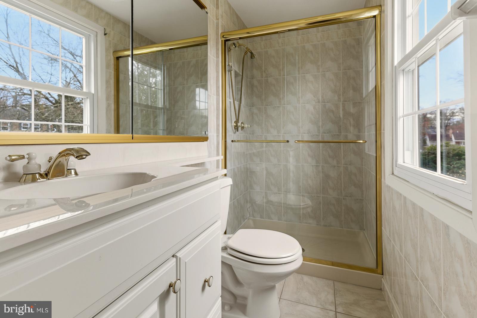 8714 Granite Lane Laurel, MD 20708 - Photo 31 of 35 a bathroom with a sink and a shower