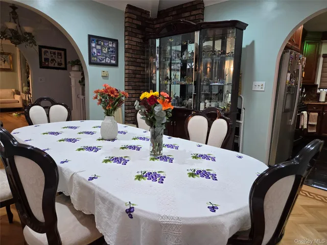 a large white table and chairs in a room