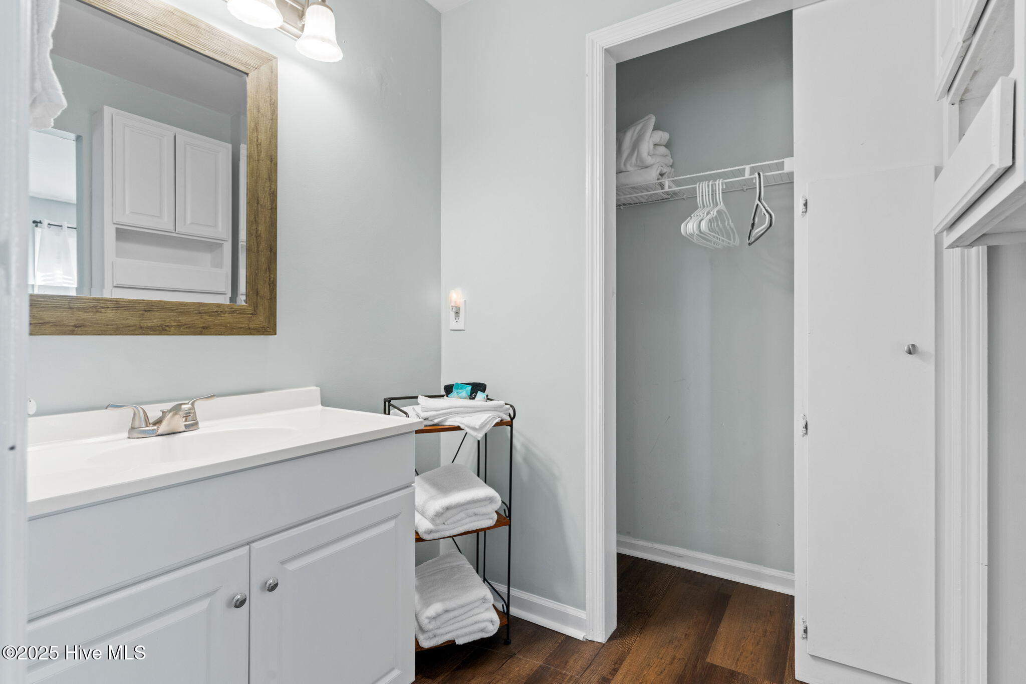 213 Clubhouse Road, Unit 105 Sunset Beach, NC 28468 - Photo 25 of 36 lockout vanity and closet