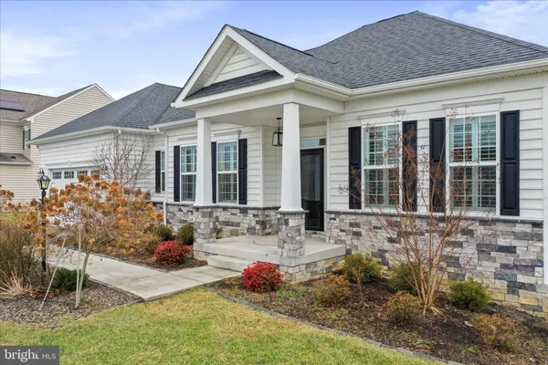 a front view of a house with patio
