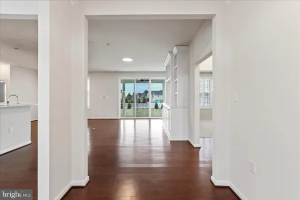 a view of an entryway with wooden floor