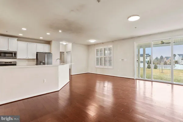 a view of kitchen with cabinets and wooden floor