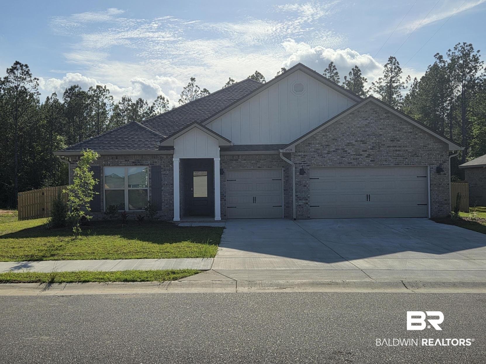11528 Thistledown Loop Daphne, AL 36527 - Photo 1 of 58 Modern brick exterior with white siding accents and a covered entry
