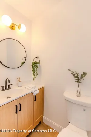 a bathroom with a sink and mirror