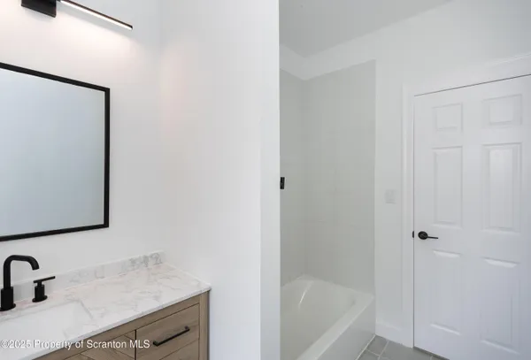 a bathroom with a sink and a bathtub