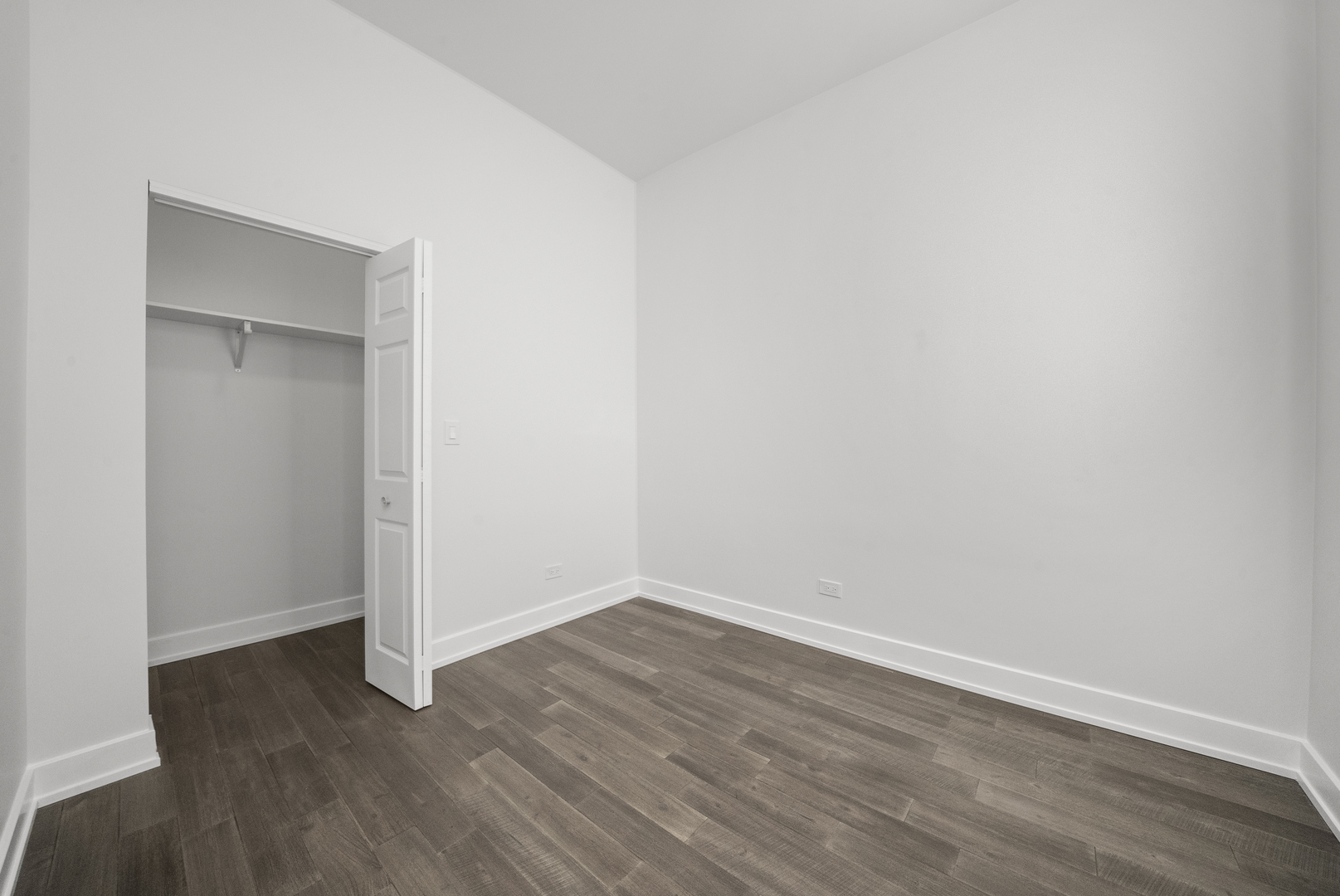 3824 West Fulton Street Chicago, IL 60624 - Photo 16 of 30 a view of an empty room with wooden floor