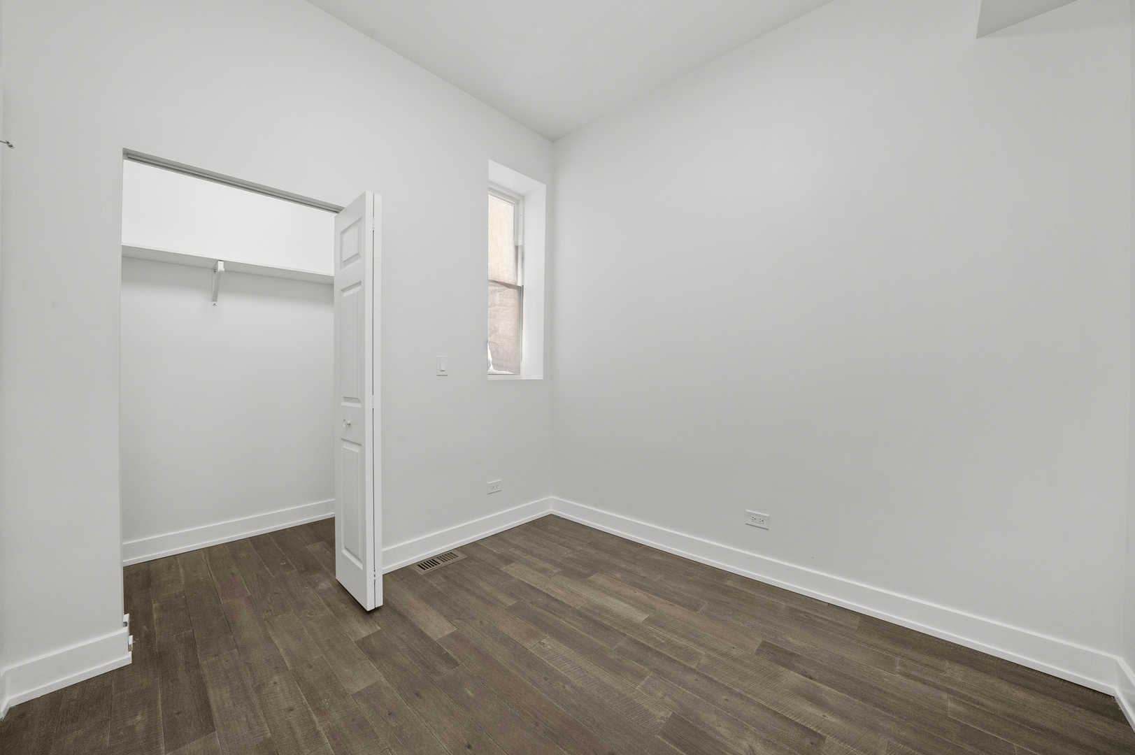 3824 West Fulton Street Chicago, IL 60624 - Photo 8 of 30 an empty room with wooden floor and windows