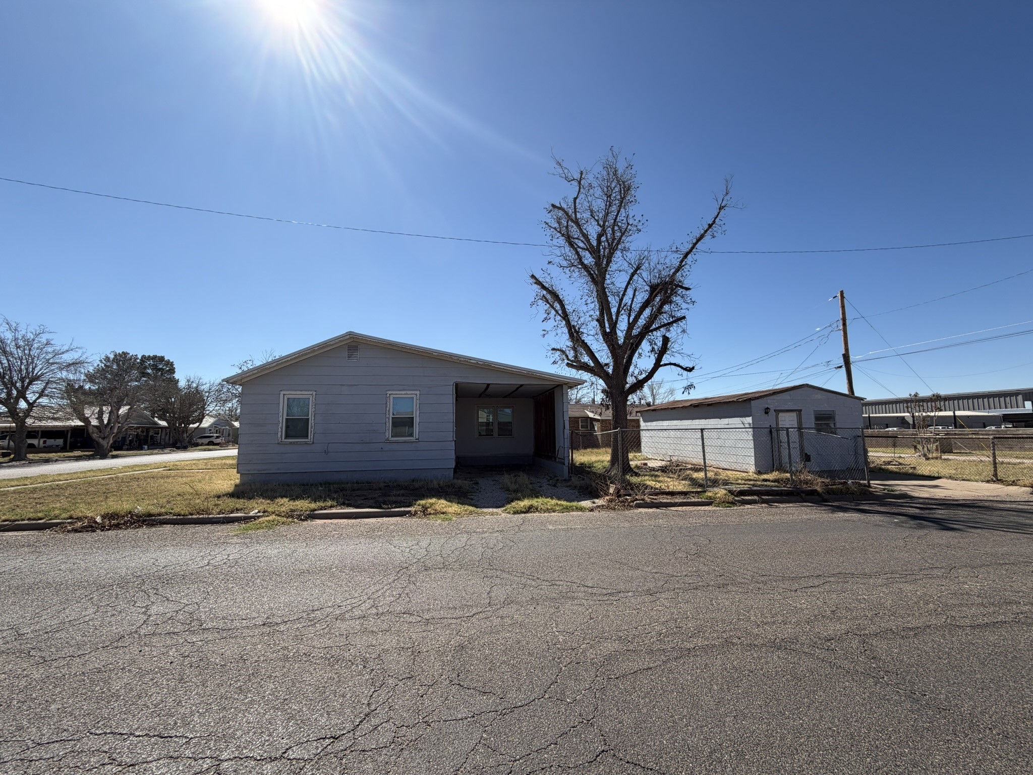 813 Northwest 1st Street Andrews, TX 79714 - Photo 13 of 13 a large house with a large parking space and a car parked