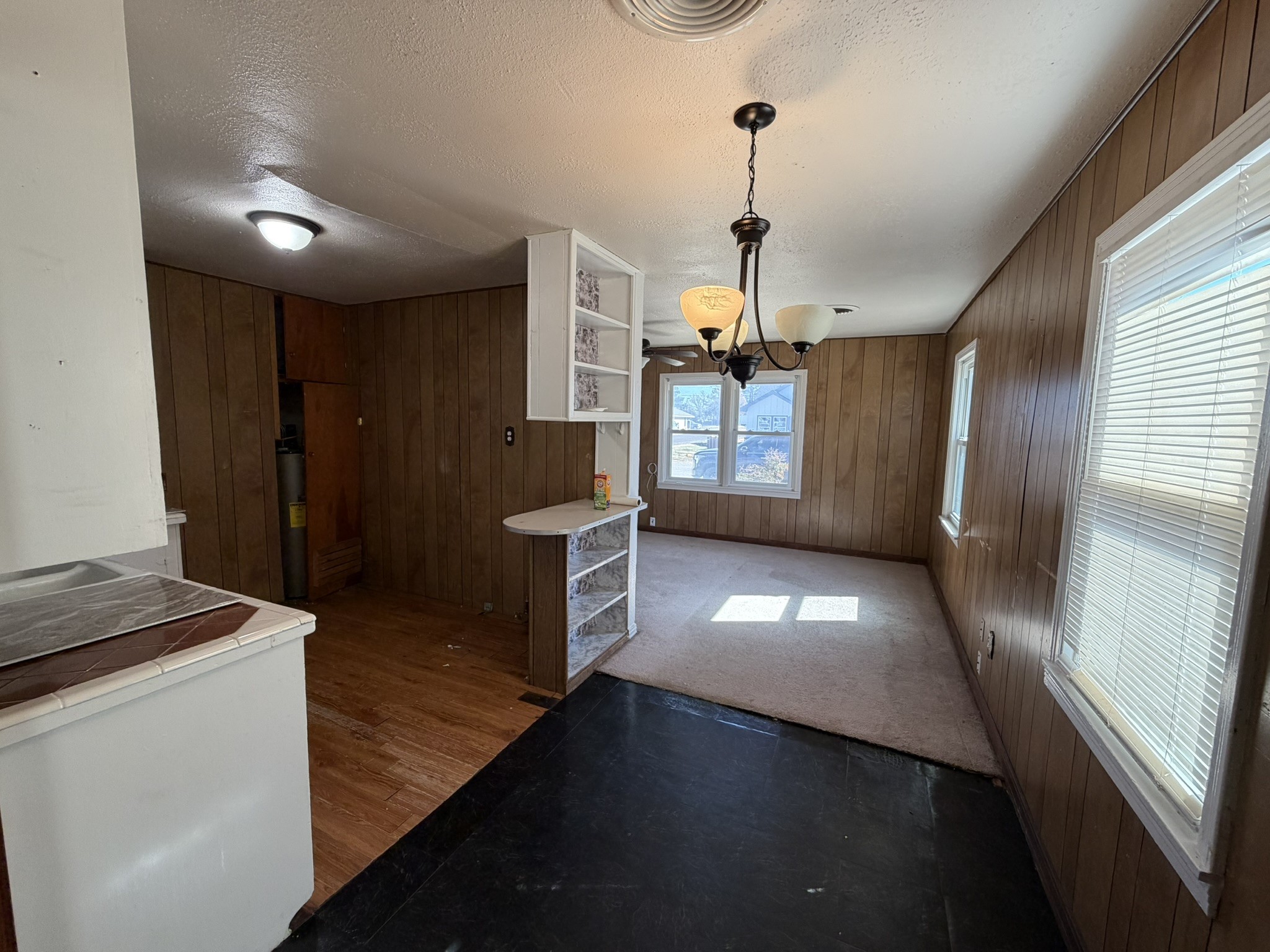 813 Northwest 1st Street Andrews, TX 79714 - Photo 6 of 13 a view of a hallway with kitchen