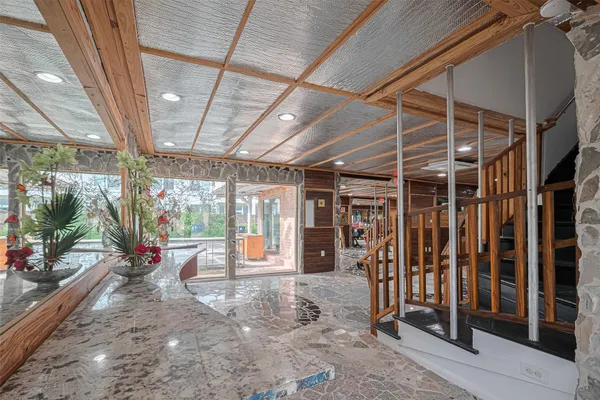 a view of a room with wooden floor