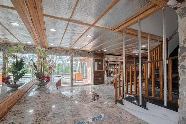 a view of a room with wooden floor