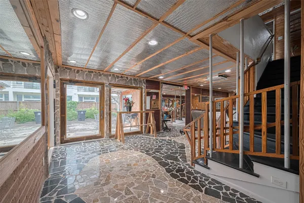 a view of a room with wooden floor