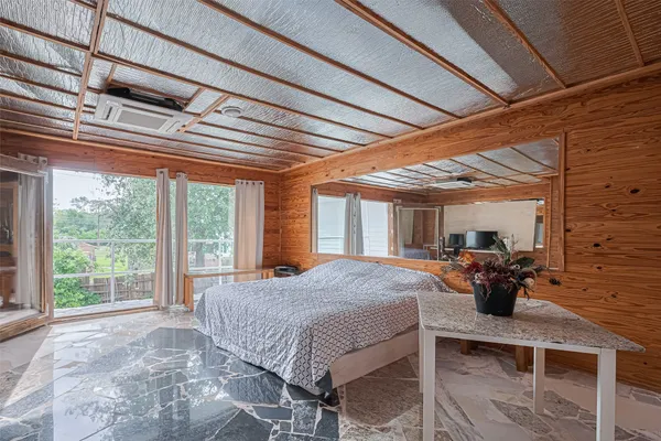 a bed room with a bed and a table