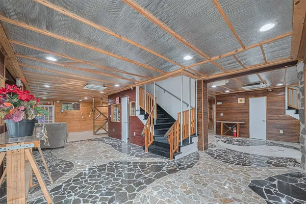 a view of a room with wooden floor