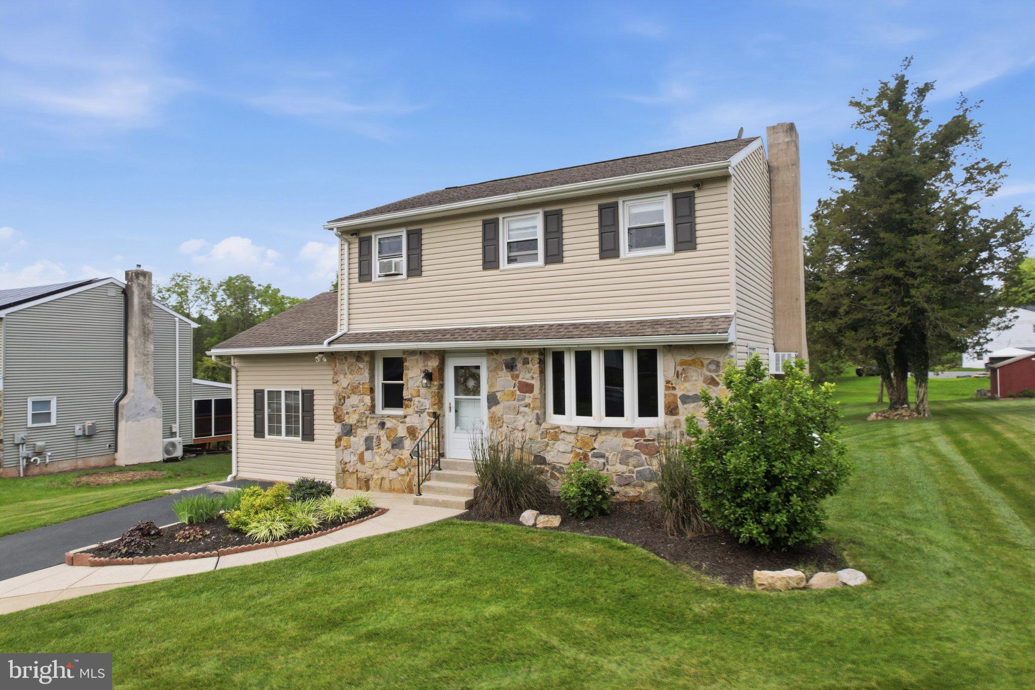 1385 Woodmere Road Pottstown, PA 19464 - Photo 5 of 63 Charming home with lush green surroundings.