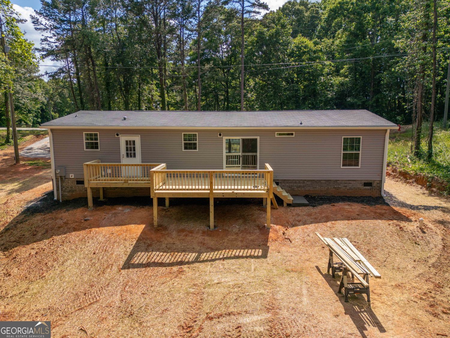 734 Hollywood Church Road Clarkesville, GA 30523 - Photo 47 of 49 a view of a house with a backyard and trees