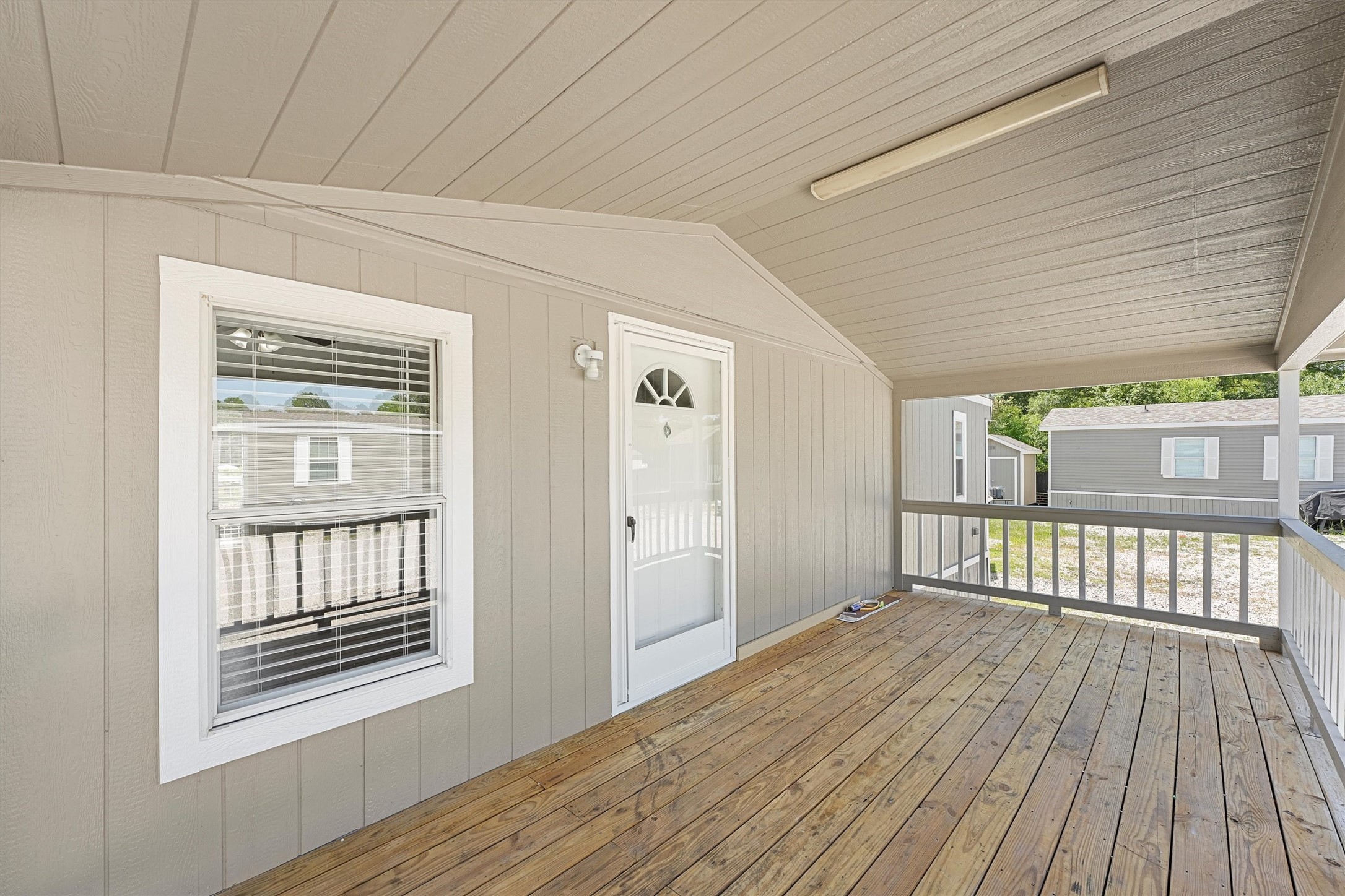 21864 Russell Drive New Caney, TX 77357 - Photo 2 of 15 a bedroom with a bed and wooden floor