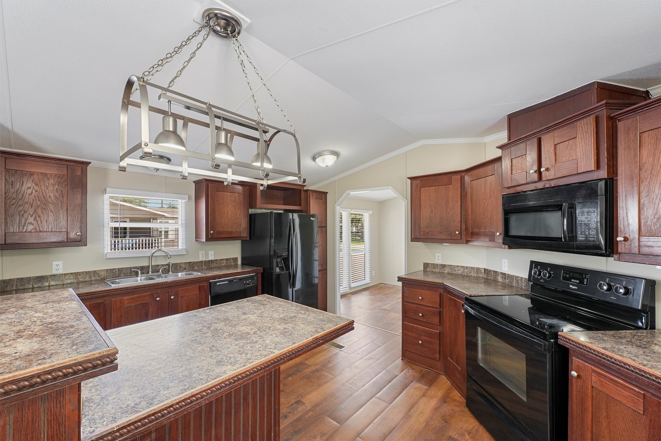 21864 Russell Drive New Caney, TX 77357 - Photo 5 of 15 a kitchen with stainless steel appliances granite countertop a sink stove and refrigerator