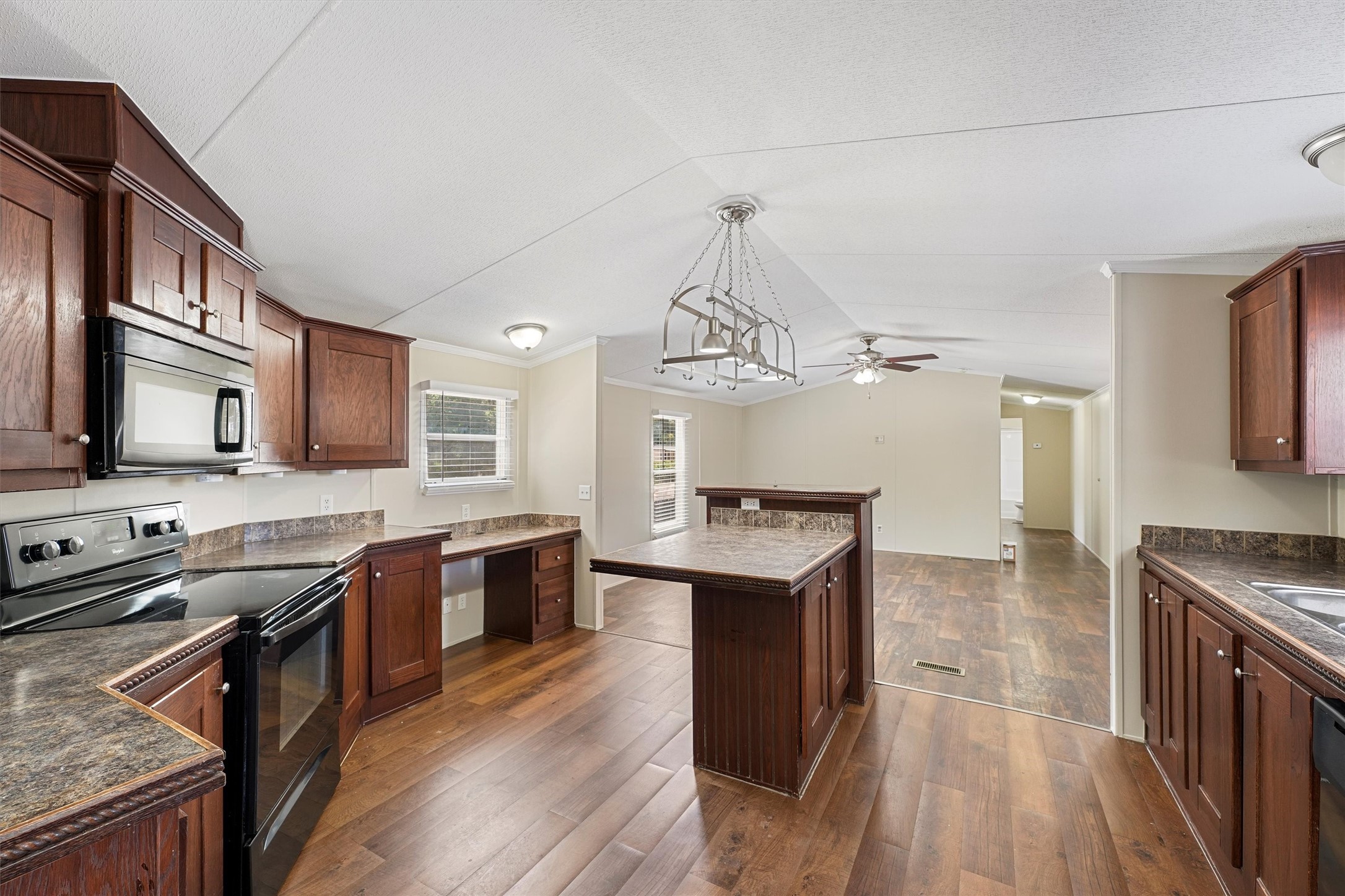 21864 Russell Drive New Caney, TX 77357 - Photo 6 of 15 a kitchen with stainless steel appliances granite countertop a sink stove and refrigerator