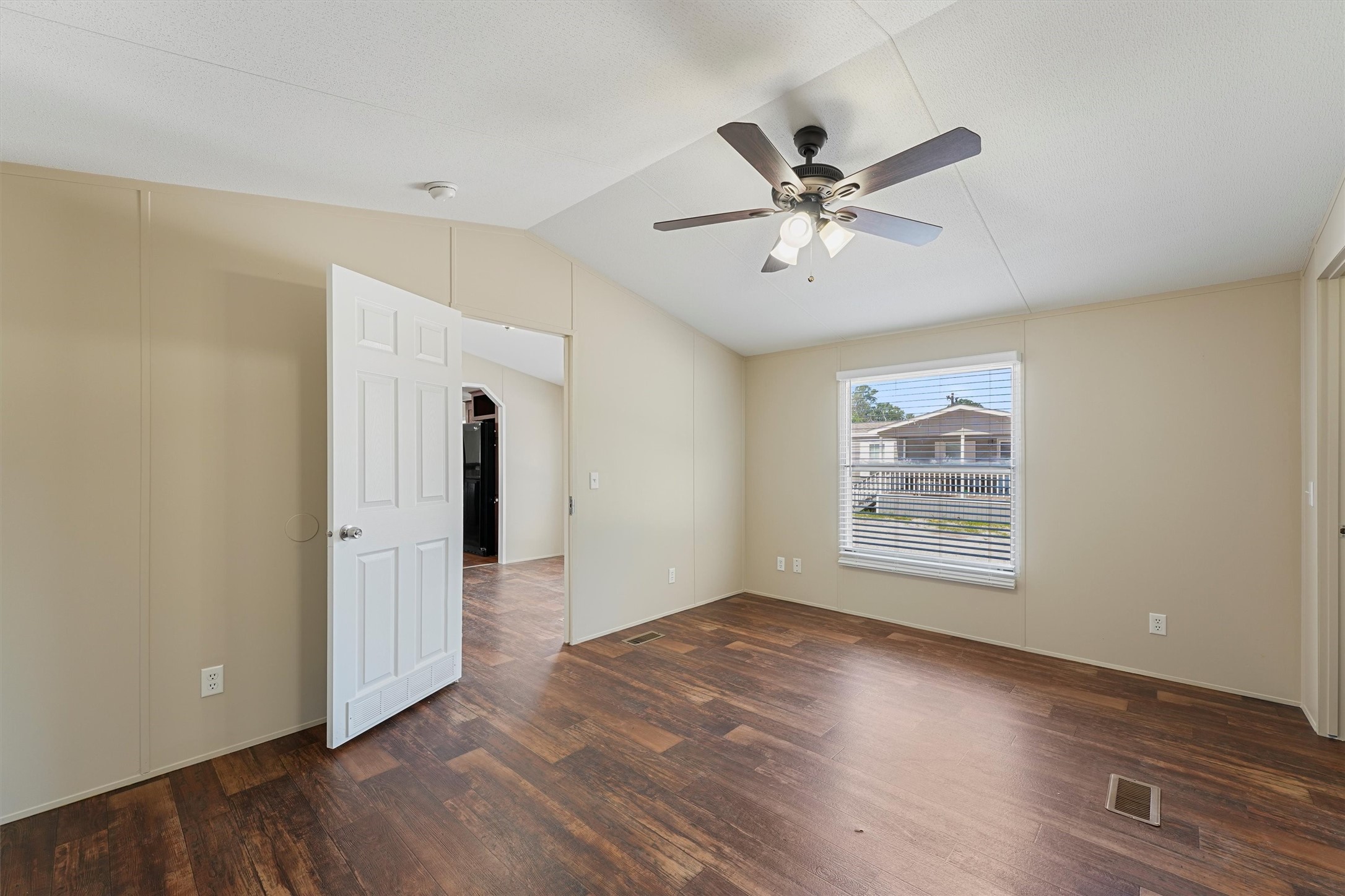 21864 Russell Drive New Caney, TX 77357 - Photo 9 of 15 a view of an empty room with window and wooden floor