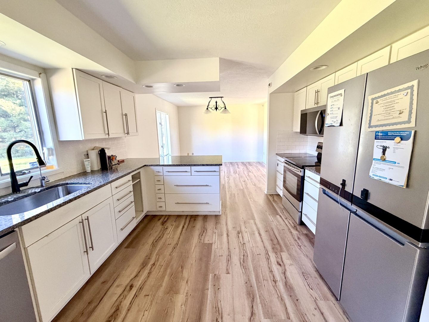 120 Grandin Road Morris, IL 60450 - Photo 11 of 38 a large kitchen with a sink and wooden floor