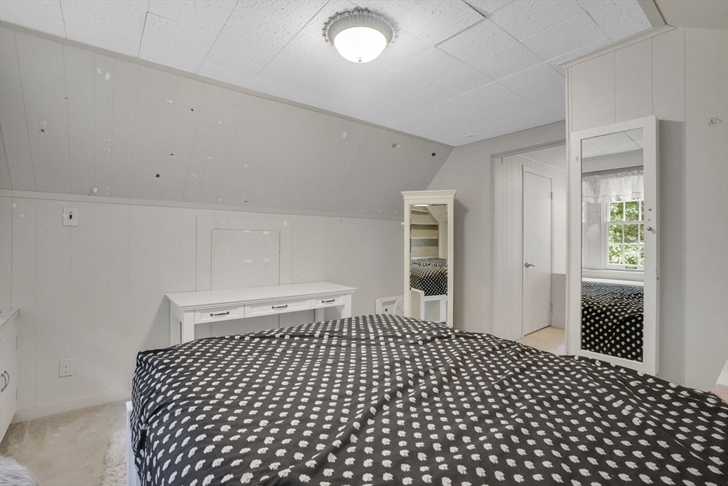 70 Dover Road Longmeadow, MA 01106 - Photo 30 of 37 a bedroom with a black and white checkered floor