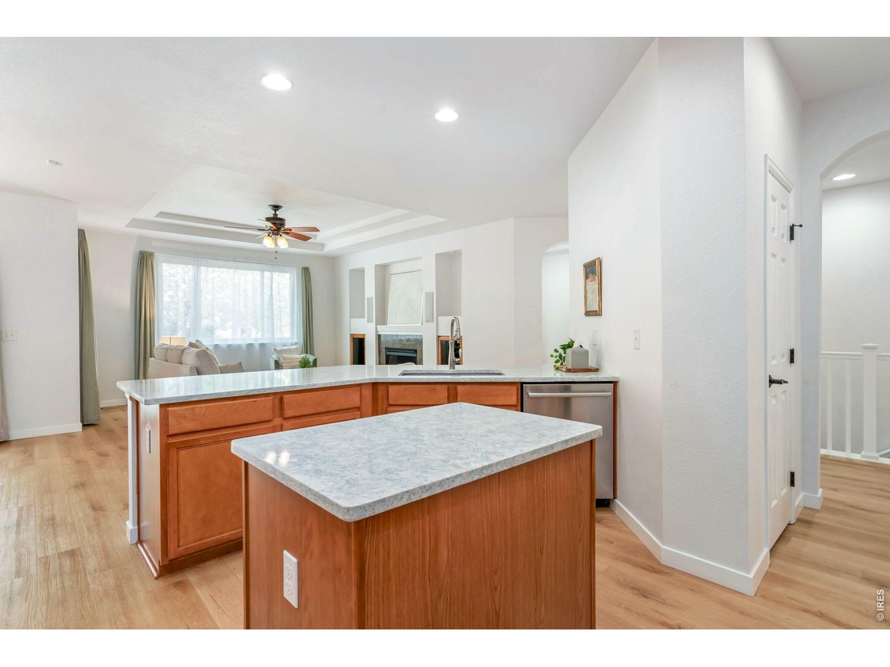 5574 Quarry Street Timnath, CO 80547 - Photo 13 of 43 a dining hall with stainless steel appliances granite countertop wooden cabinets and granite counter tops