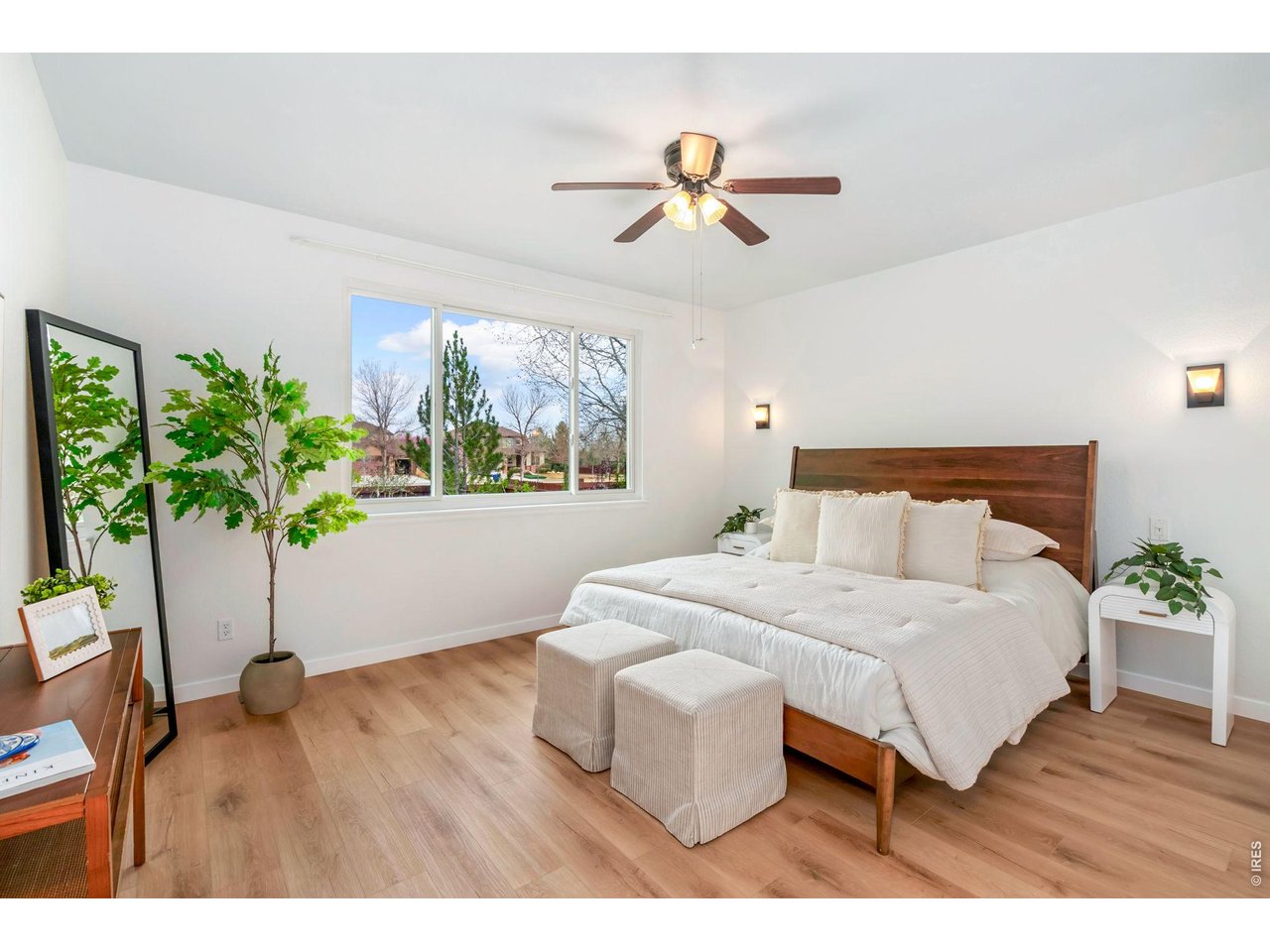 5574 Quarry Street Timnath, CO 80547 - Photo 19 of 43 a bedroom with a bed and a potted plant