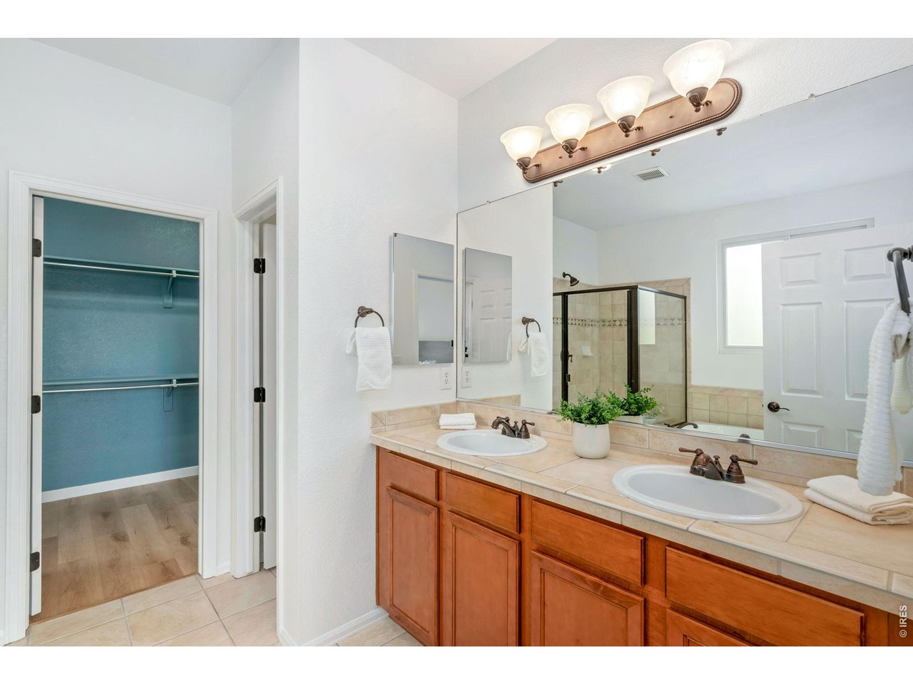 5574 Quarry Street Timnath, CO 80547 - Photo 21 of 43 a bathroom with a sink double vanity and a mirror