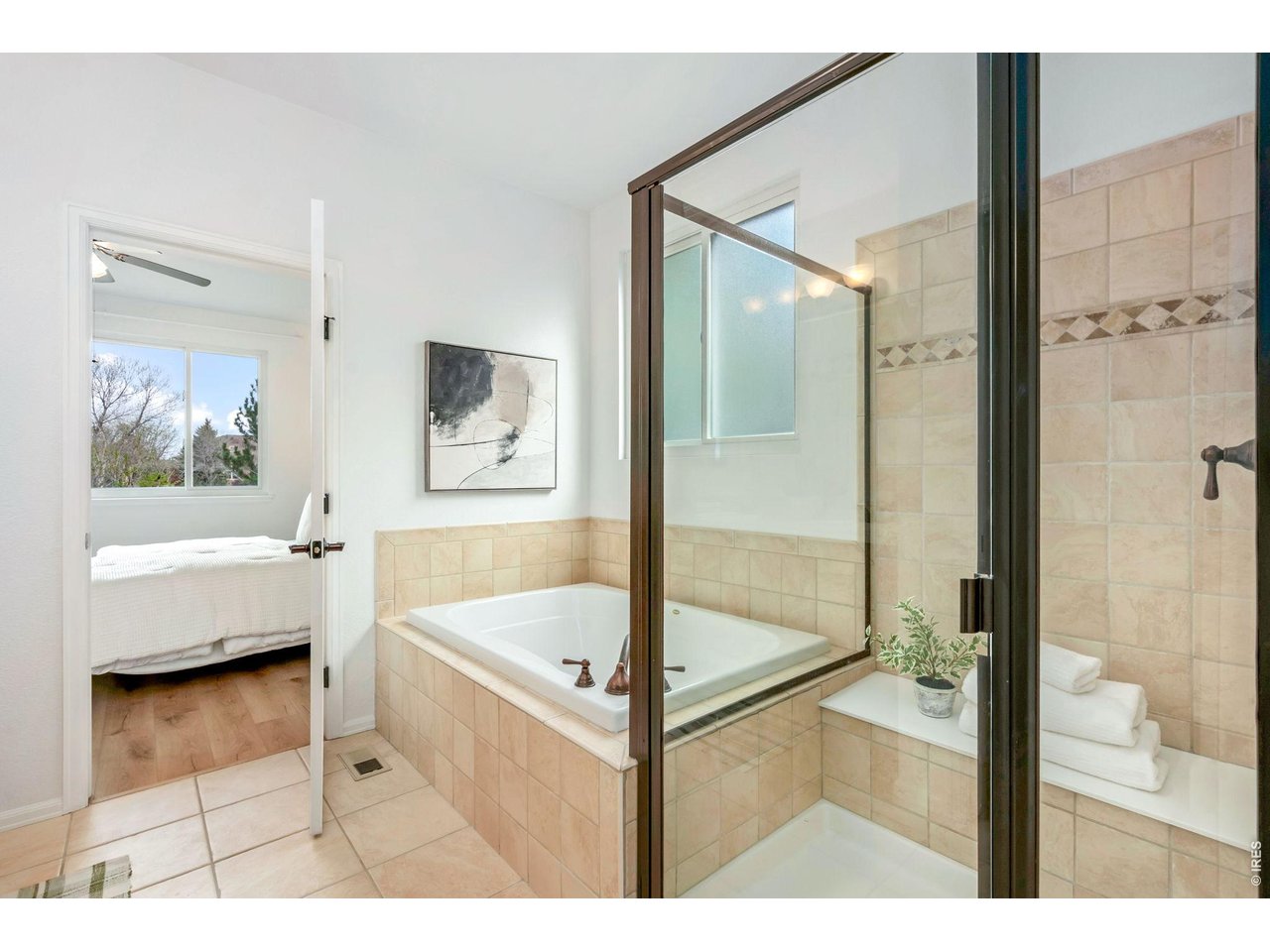 5574 Quarry Street Timnath, CO 80547 - Photo 23 of 43 a bathroom with a tub and shower