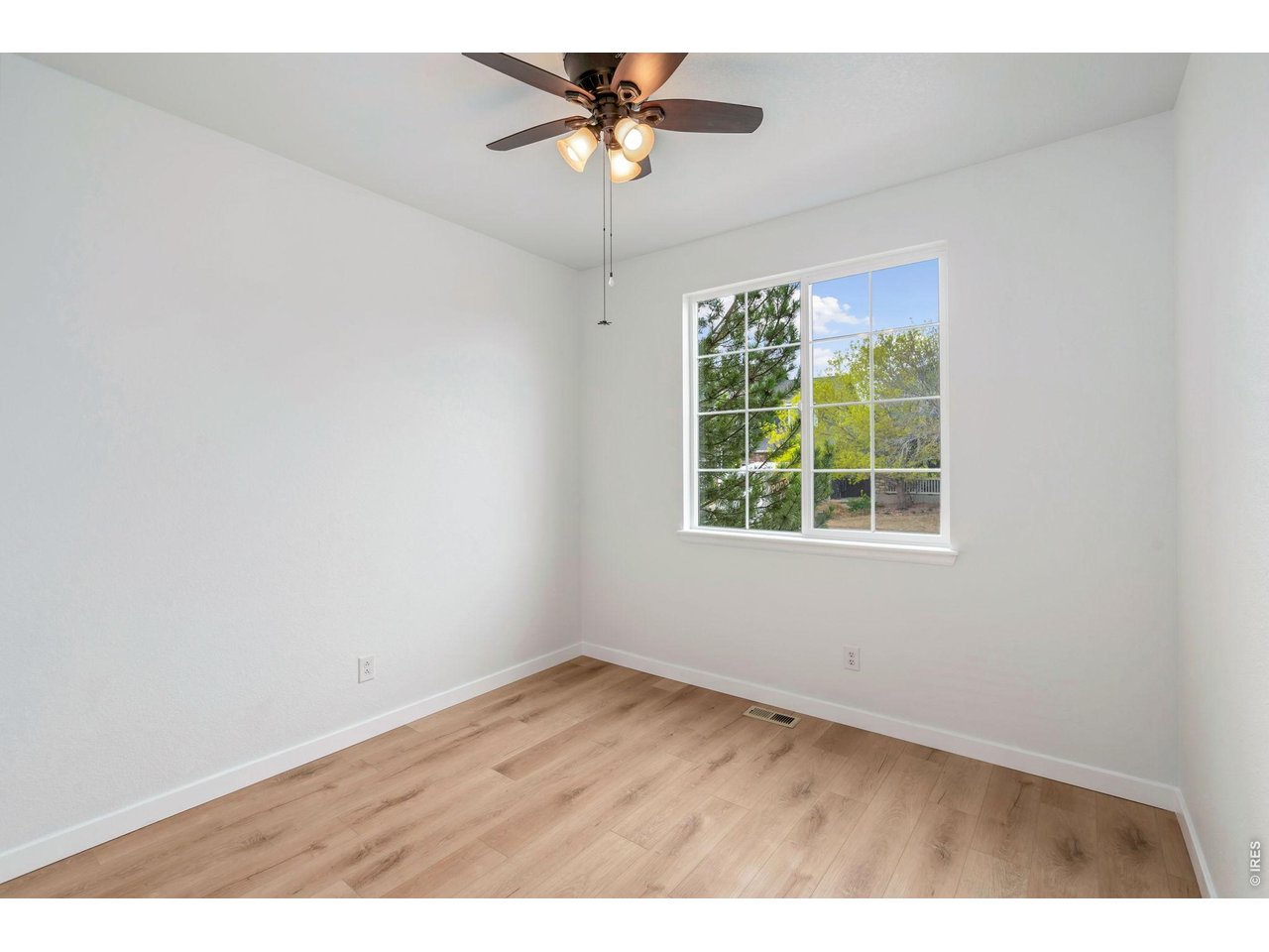 5574 Quarry Street Timnath, CO 80547 - Photo 26 of 43 a view of an empty room with a window